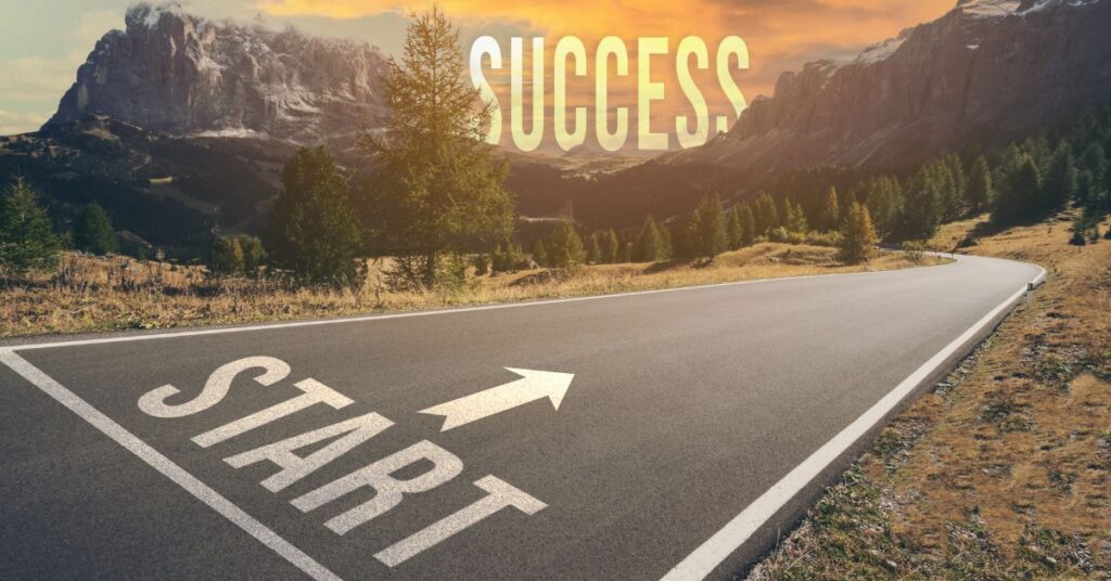 Road leading to success with the word Start' on the pavement and 'Success' in the sky