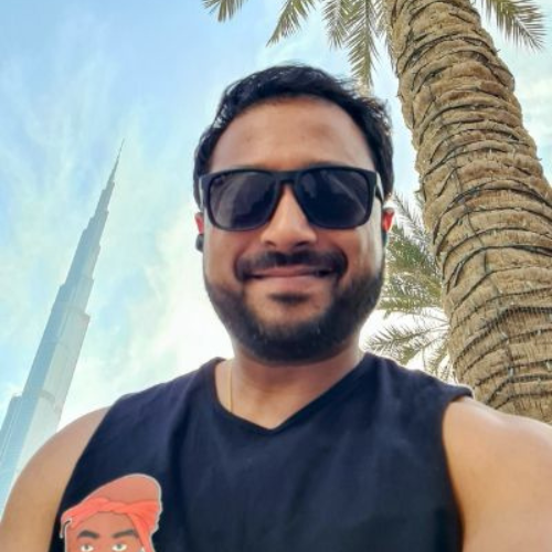 Sunny smiling in front of the Burj Al Khalifa